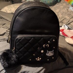 Black Quilted Backpack with Metal Studs and Pom Pom